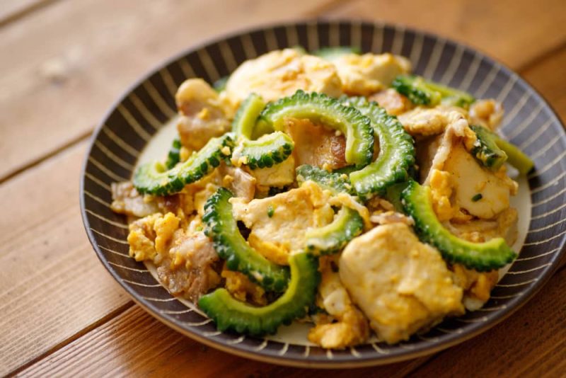 Bitter melon stir-fried with pork, tofu and egg, a traditional japanese dish.